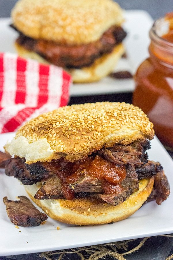 Slow-smoked until tender and juicy, this Smoked Beef Chuck Roast is served with a (surprisingly easy) Maple Bourbon BBQ Sauce!