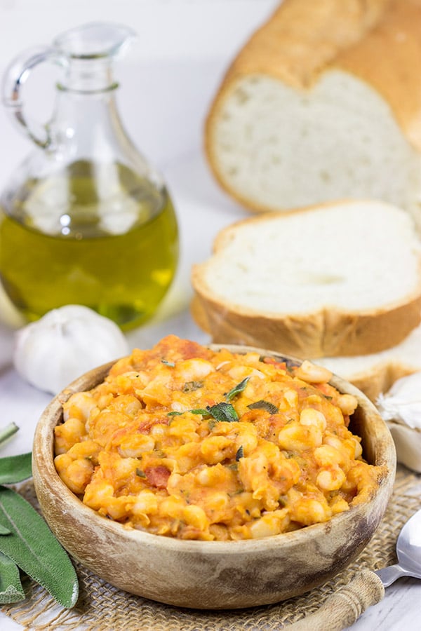 These Tuscan White Beans are a simple, yet delicious Italian recipe featuring white beans, olive oil, San Marzano tomatoes and a bit of fresh sage. Enjoy!