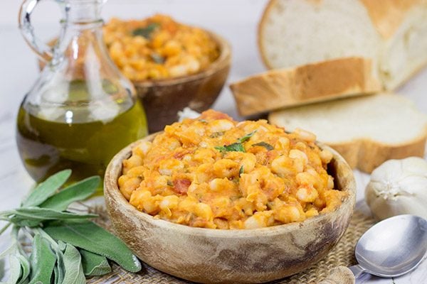 These Tuscan White Beans are a simple, yet delicious Italian recipe featuring white beans, olive oil, San Marzano tomatoes and a bit of fresh sage.  Enjoy!