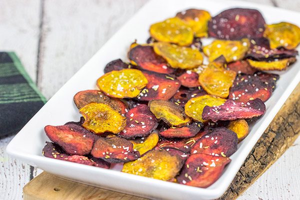 Seasoned with a bit of rosemary and salt, these Baked Beet Chips make for a fun and healthy snack!