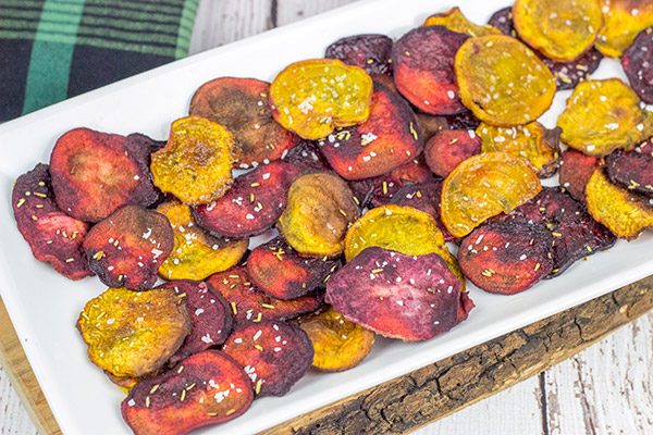 Seasoned with a bit of rosemary and salt, these Baked Beet Chips make for a fun and healthy snack!