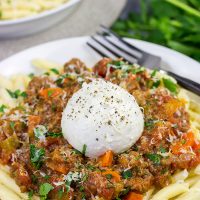 Burrata cheese on top of pasta is simply magical, and this Burrata Bolognese takes it to a whole new level of deliciousness!