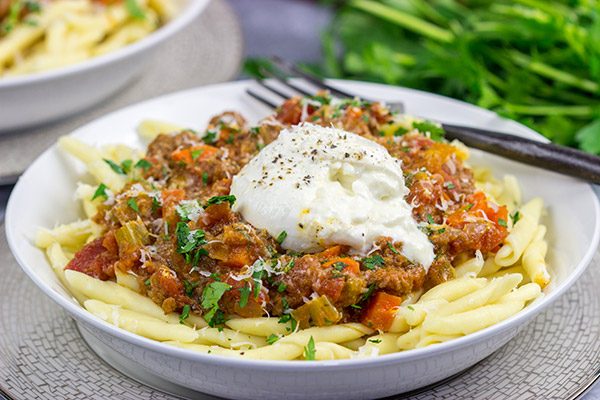 Burrata cheese on top of pasta is simply magical, and this Burrata Bolognese takes it to a whole new level of deliciousness!