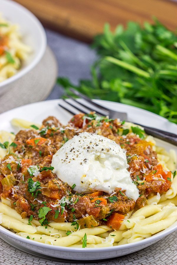 Burrata cheese on top of pasta is simply magical, and this Burrata Bolognese takes it to a whole new level of deliciousness!