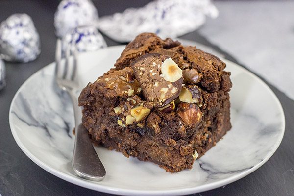 Filled with a layer of hazelnut cheesecake and topped with chopped Baci, these Chocolate Hazelnut Cheesecake Brownies are a great way to celebrate National Chocolate Day!