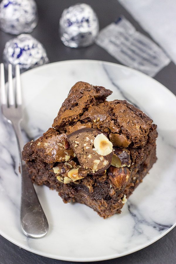 Filled with a layer of hazelnut cheesecake and topped with chopped Baci, these Chocolate Hazelnut Cheesecake Brownies are a great way to celebrate National Chocolate Day!