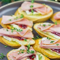 Looking for a fun way to elevate your holiday appetizers? These Ham, Brie and Cranberry Crostini are layered with tasty flavors, and they're a cinch to make!