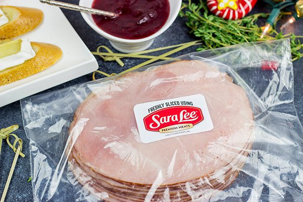 Looking for a fun way to elevate your holiday appetizers?  These Ham, Brie and Cranberry Crostini are layered with tasty flavors, and they're a cinch to make!