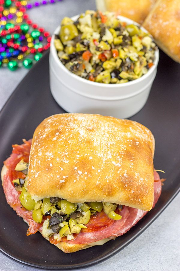 These Muffaletta Panini are a twist on the classic New Orleans' sandwich, and they're the perfect way to celebrate Mardi Gras!