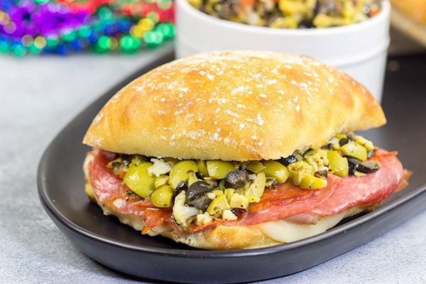 These Muffaletta Panini are a twist on the classic New Orleans' sandwich, and they're the perfect way to celebrate Mardi Gras!