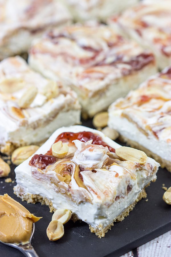 These PB&J Cheesecake Bars are an easy and delicious way to celebrate National Peanut Butter and Jelly Day!  (They're also a great dessert for any other day of the year, too!)