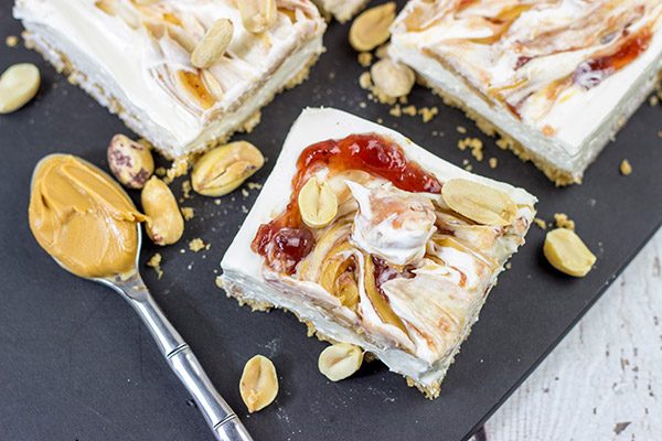 These PB&J Cheesecake Bars are an easy and delicious way to celebrate National Peanut Butter and Jelly Day!  (They're also a great dessert for any other day of the year, too!)