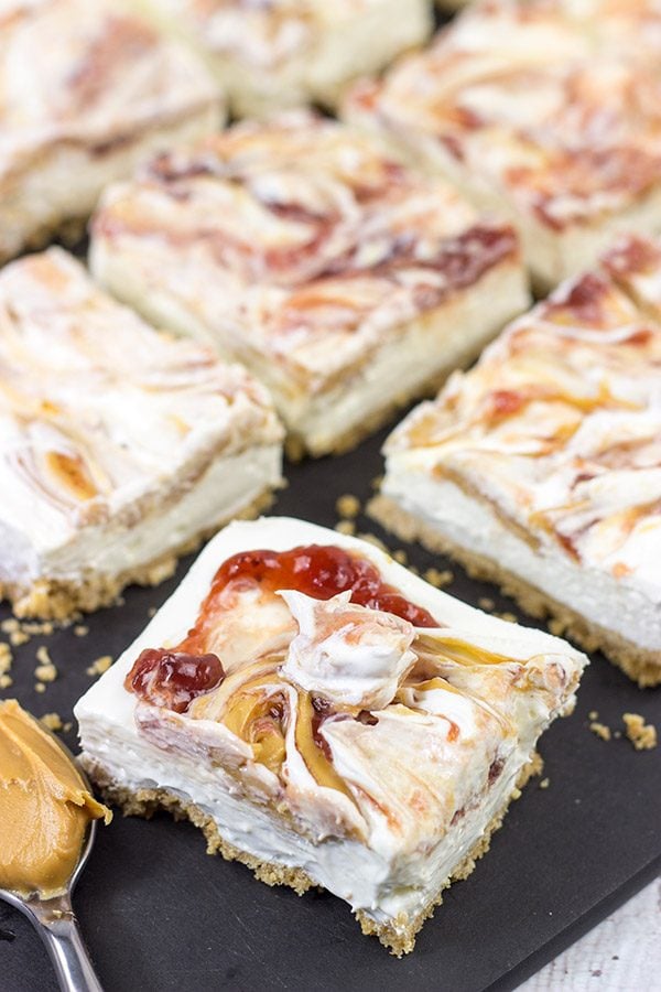 These PB&J Cheesecake Bars are an easy and delicious way to celebrate National Peanut Butter and Jelly Day!  (They're also a great dessert for any other day of the year, too!)