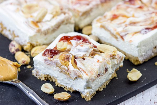 These PB&J Cheesecake Bars are an easy and delicious way to celebrate National Peanut Butter and Jelly Day!  (They're also a great dessert for any other day of the year, too!)
