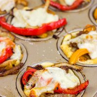 These Philly Cheesesteak Cups feature ribeye steak, peppers and onions all baked in mini crescent roll cups. They're the perfect comfort food appetizer for football season!