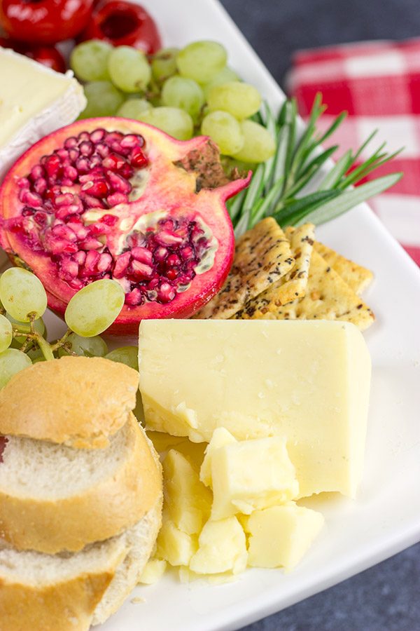 A Holiday Charcuterie Board is a great addition to any holiday party.  Here are some and tricks for turning your cheese board into the talk of the party!