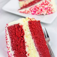 1 layer of cheesecake + 2 layers of red velvet cake = 3 layers of awesome! This Red Velvet Cheesecake Cake is a tasty way to celebrate Valentine's Day...or any other day of the year!