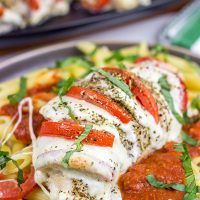 Filled with creamy mozzarella cheese, Roma tomatoes and freshly chopped basil, this Stuffed Chicken Caprese recipe is a new favorite in our house!