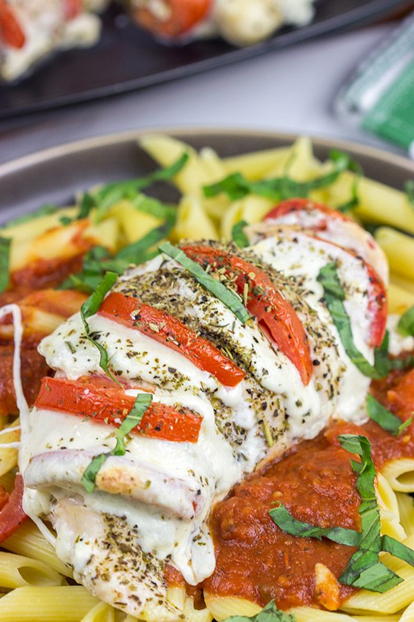 Filled with creamy mozzarella cheese, Roma tomatoes and freshly chopped basil, this Stuffed Chicken Caprese recipe is a new favorite in our house!