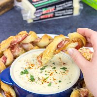 Bacon. Cheese. Breadsticks. What else do you need? These Bacon Wrapped Breadsticks with Queso are a unique and delicious football party appetizer!