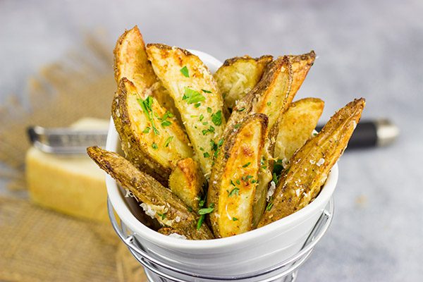 These Garlic Parmesan Baked Potato Wedges are an easy side dish that pairs well with all sorts of other dinner recipes!