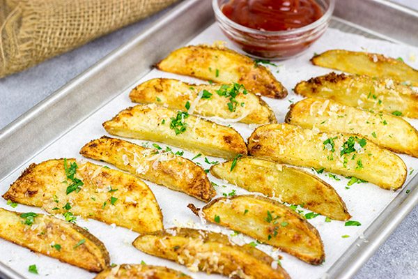 These Garlic Parmesan Baked Potato Wedges are an easy side dish that pairs well with all sorts of other dinner recipes!