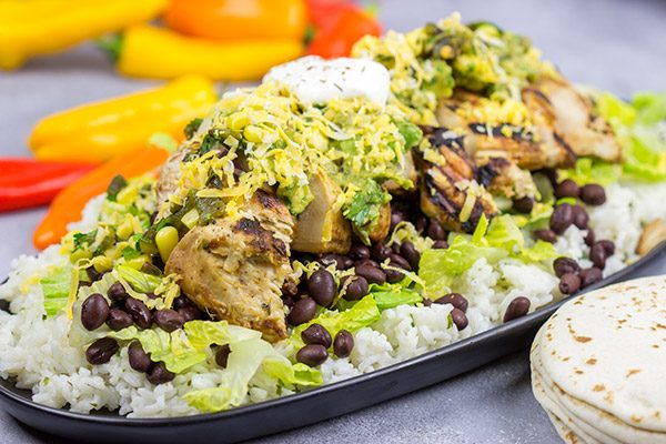 Looking for a delicious and fun recipe to grill this weekend? Put these Grilled Jerk Chicken Burrito Bowls on the menu!
