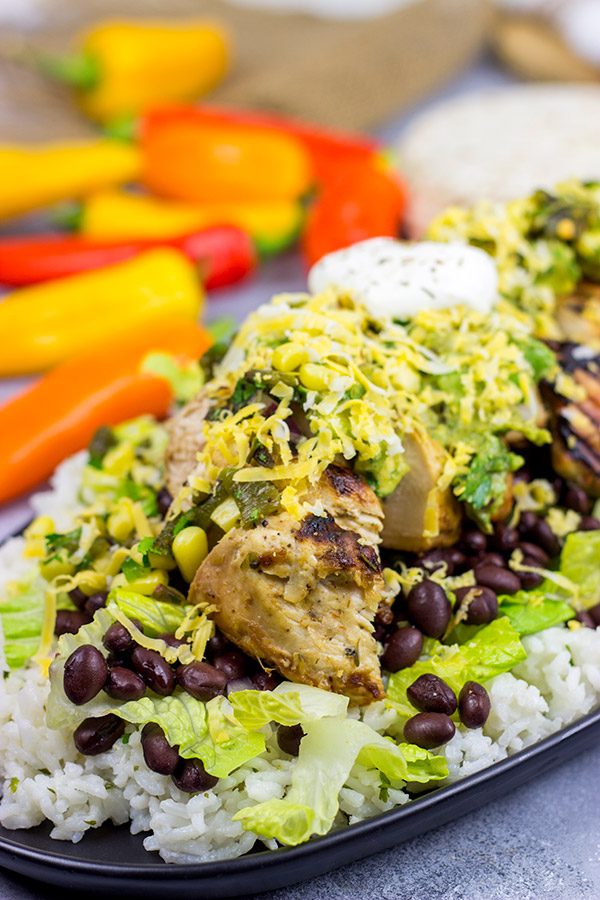 Looking for a delicious and fun recipe to grill this weekend? Put these Grilled Jerk Chicken Burrito Bowls on the menu!