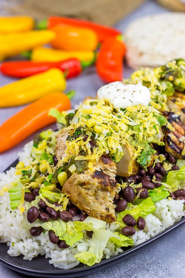 Looking for a delicious and fun recipe to grill this weekend? Put these Grilled Jerk Chicken Burrito Bowls on the menu!