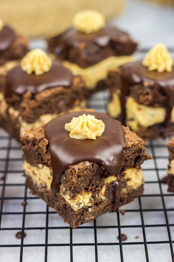 Looking for a dessert that's sure to impress your friends and family?  These Peanut Butter Cookie Dough Stuffed Brownies are a winner!