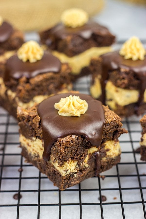 Looking for a dessert that's sure to impress your friends and family?  These Peanut Butter Cookie Dough Stuffed Brownies are a winner!