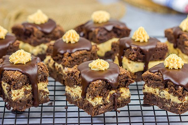 Looking for a dessert that's sure to impress your friends and family? These Peanut Butter Cookie Dough Stuffed Brownies are a winner!