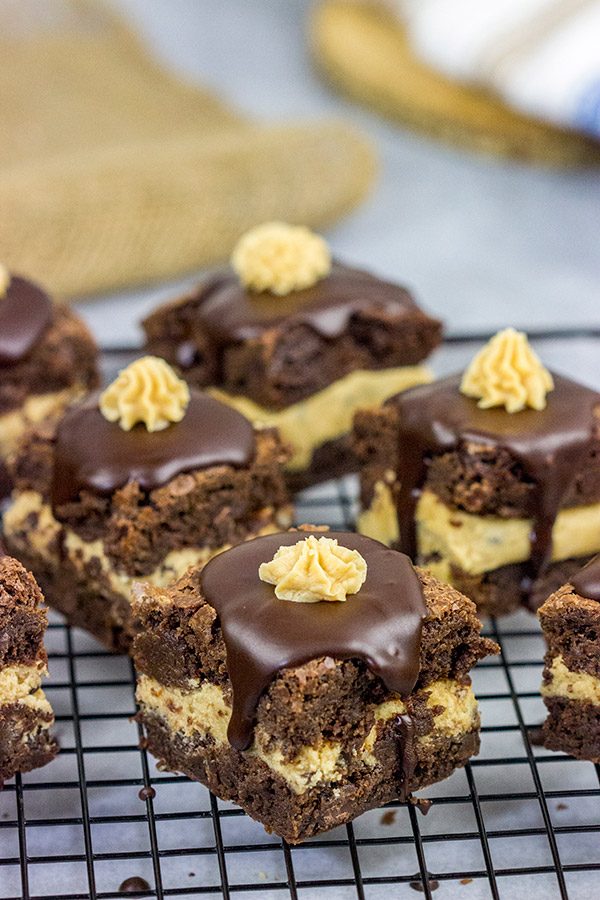 Looking for a dessert that's sure to impress your friends and family? These Peanut Butter Cookie Dough Stuffed Brownies are a winner!
