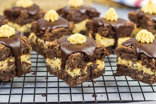 Looking for a dessert that's sure to impress your friends and family?  These Peanut Butter Cookie Dough Stuffed Brownies are a winner!