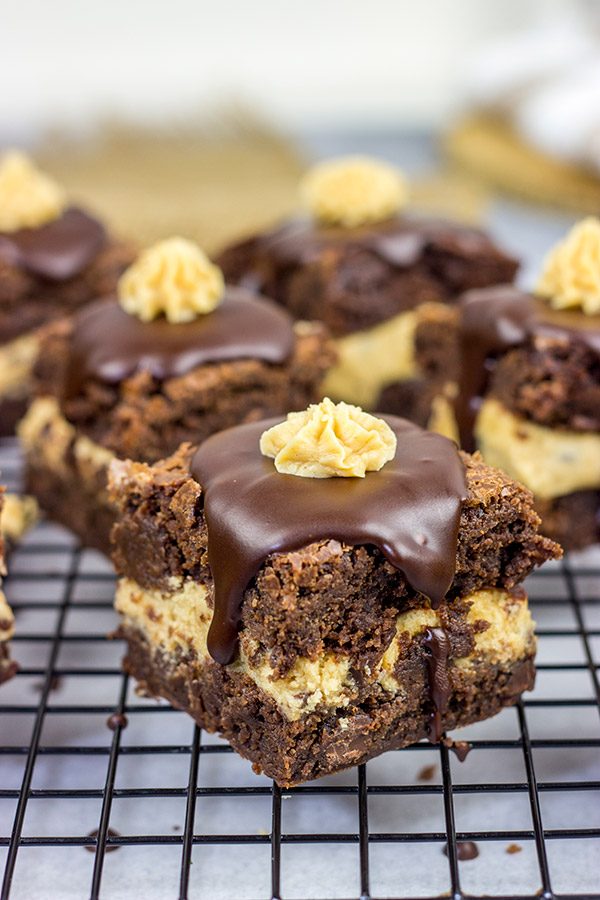 Looking for a dessert that's sure to impress your friends and family?  These Peanut Butter Cookie Dough Stuffed Brownies are a winner!