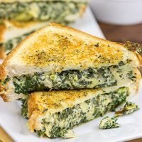 This Spinach Artichoke Grilled Cheese is what happens when you run out of tortilla chips.  I think I stumbled onto a favorite new idea for grilled cheese sandwiches!