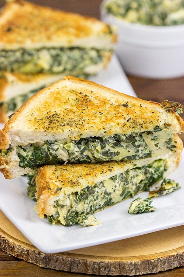 This Spinach Artichoke Grilled Cheese is what happens when you run out of tortilla chips.  I think I stumbled onto a favorite new idea for grilled cheese sandwiches!