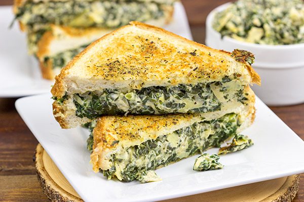 This Spinach Artichoke Grilled Cheese is what happens when you run out of tortilla chips.  I think I stumbled onto a favorite new idea for grilled cheese sandwiches!