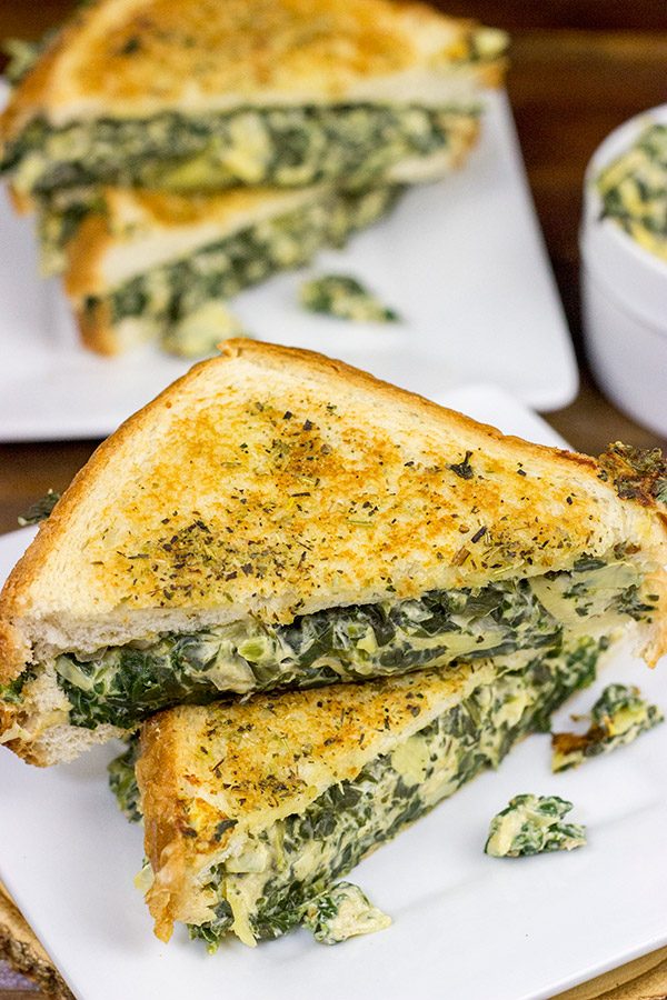 This Spinach Artichoke Grilled Cheese is what happens when you run out of tortilla chips.  I think I stumbled onto a favorite new idea for grilled cheese sandwiches!
