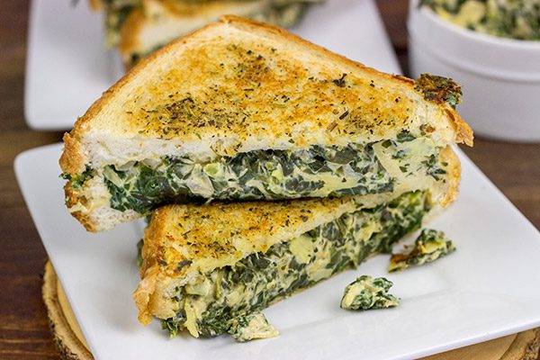 This Spinach Artichoke Grilled Cheese is what happens when you run out of tortilla chips.  I think I stumbled onto a favorite new idea for grilled cheese sandwiches!