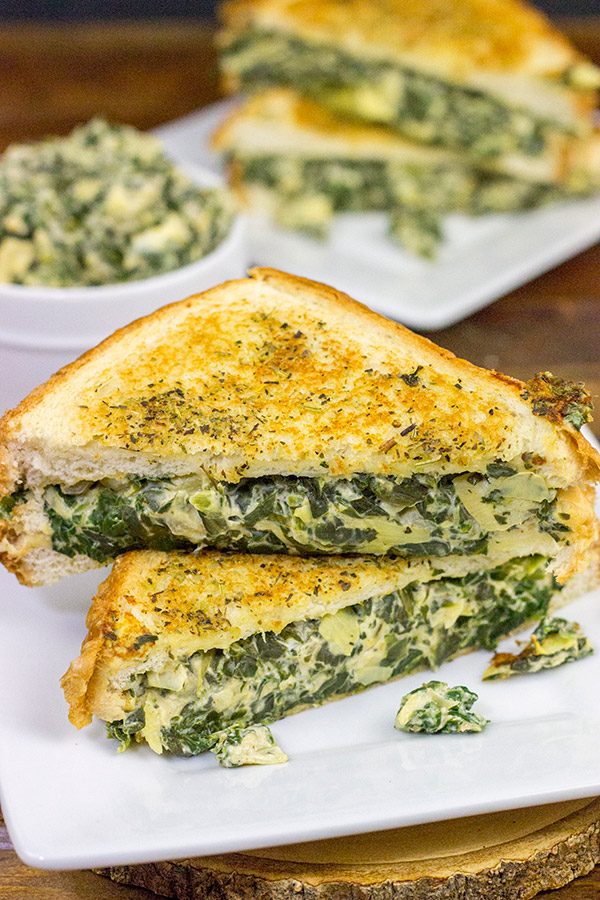 This Spinach Artichoke Grilled Cheese is what happens when you run out of tortilla chips.  I think I stumbled onto a favorite new idea for grilled cheese sandwiches!