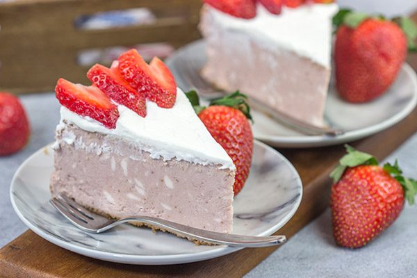 Instead of topping your cheesecake with fresh strawberries, bake 'em straight in!  This Fresh Strawberry Cheesecake is a fun dessert for warm summer days!
