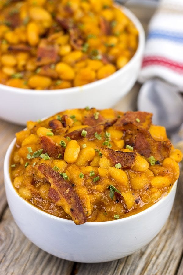 These Maple Baked Beans use slow-cooked with pure maple syrup instead of brown sugar, and the result is delicious!  These are perfect for summer picnics!