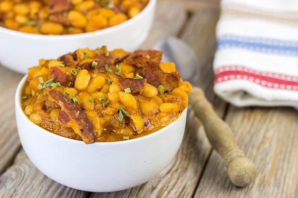 These Maple Baked Beans use slow-cooked with pure maple syrup instead of brown sugar, and the result is delicious!  These are perfect for summer picnics!