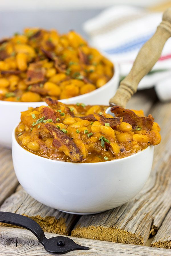 These Maple Baked Beans use slow-cooked with pure maple syrup instead of brown sugar, and the result is delicious!  These are perfect for summer picnics!