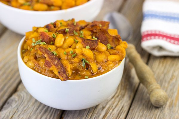 These Maple Baked Beans use slow-cooked with pure maple syrup instead of brown sugar, and the result is delicious!  These are perfect for summer picnics!