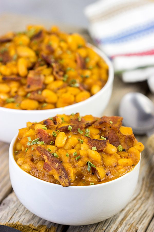 These Maple Baked Beans use slow-cooked with pure maple syrup instead of brown sugar, and the result is delicious!  These are perfect for summer picnics!