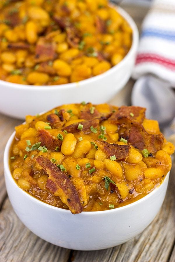 These Maple Baked Beans use slow-cooked with pure maple syrup instead of brown sugar, and the result is delicious!  These are perfect for summer picnics!