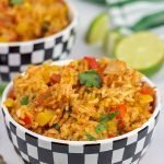 This Slow Cooker Spanish Rice is an easy and delicious side dish that's perfect for both the dog days of summer and the cold nights of winter!