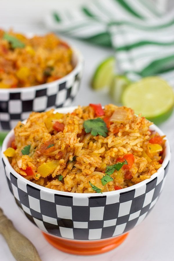 This Slow Cooker Spanish Rice is an easy and delicious side dish that's perfect for both the dog days of summer and the cold nights of winter!